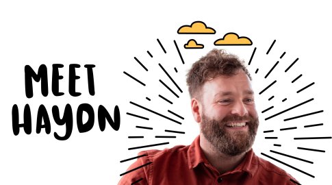 A smiling bearded man in a rust-colored shirt with illustrated rays and clouds around his head, next to bold text that reads "MEET HAYDN" on a white background.